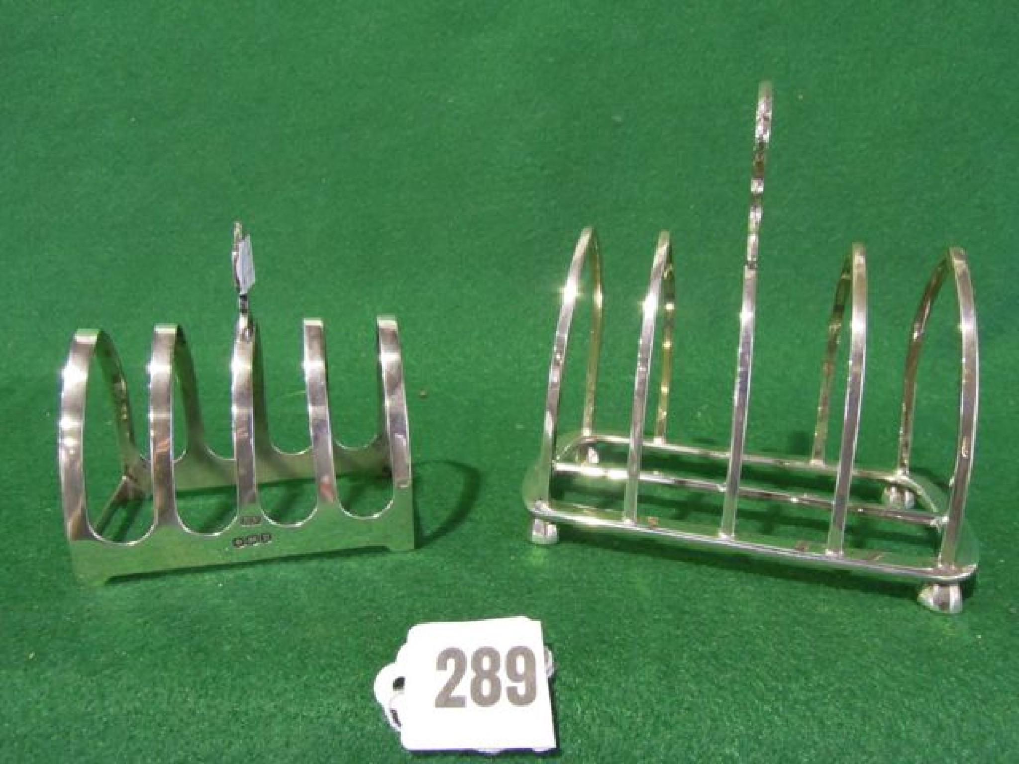 Appraisal: Two silver toast racks hallmarked Goldsmiths Silversmiths London and Viners