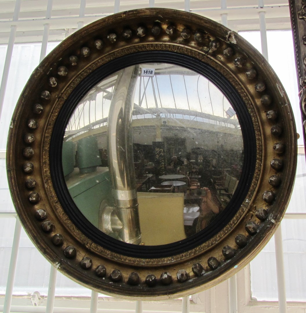 Appraisal: A Regency gilt framed ball mounted circular convex wall mirror