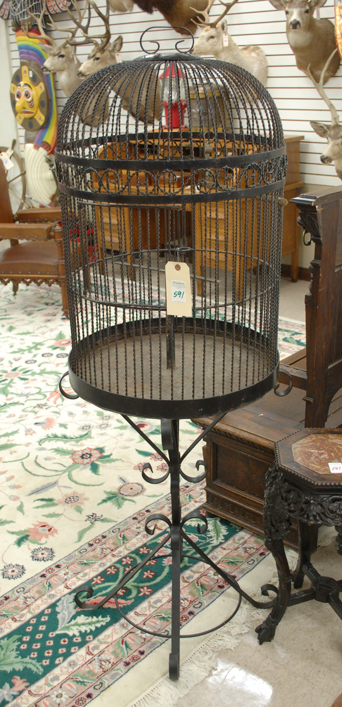 Appraisal: BLACK IRON BIRDCAGE ON STAND the round domed cage having