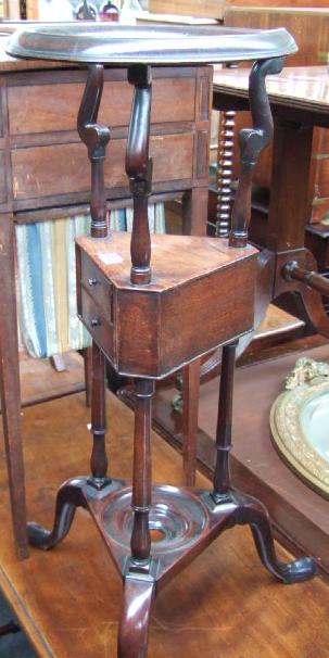 Appraisal: A George III mahogany basin stand with circular basin aperture