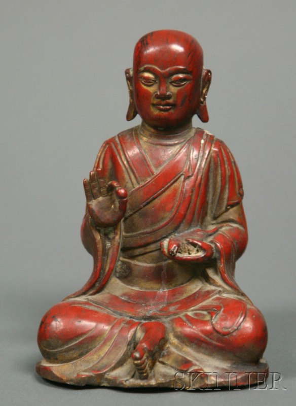 Appraisal: Iron Figure of a Buddhist Divinity China surface of red