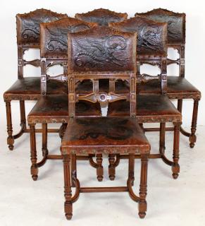 Appraisal: Set of tooled leather chairs with dragons Set of tooled