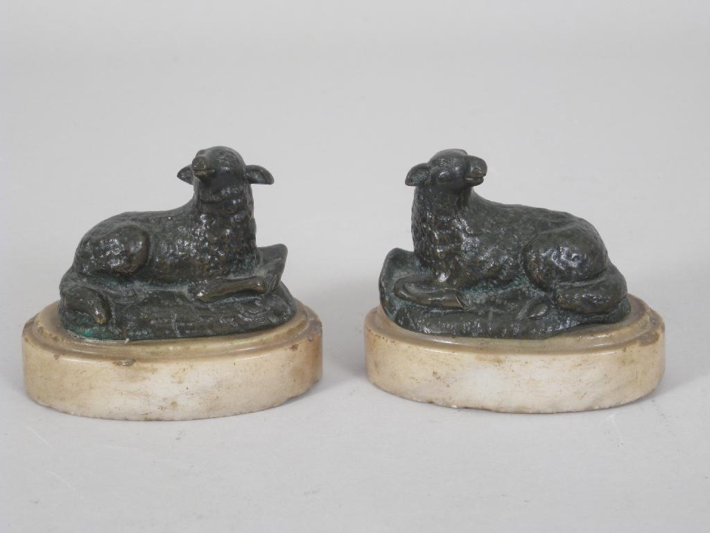 Appraisal: Pair of th Century bronze reclining Sheep on white marble