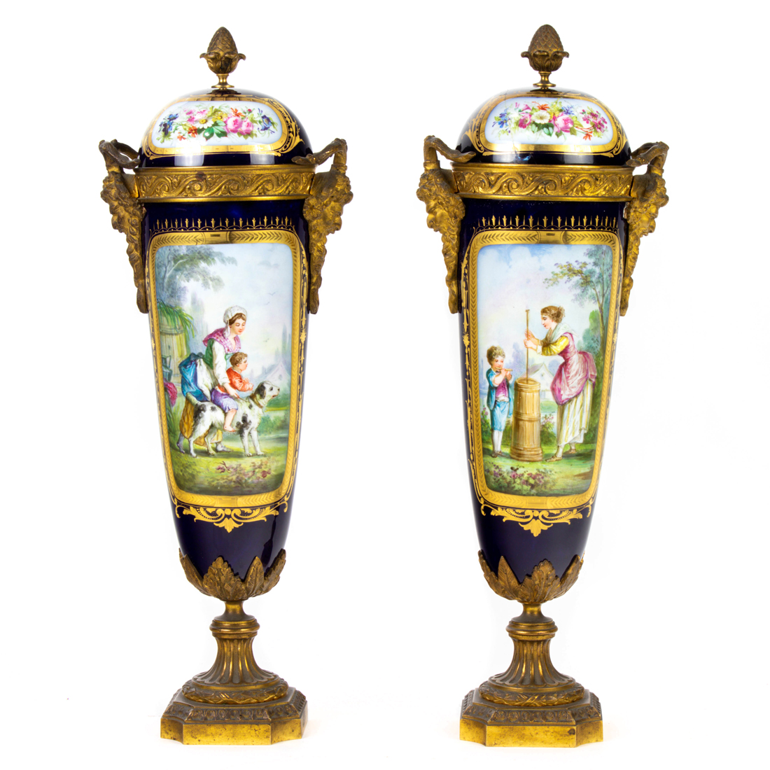 Appraisal: A pair of Sevres style gilt bronze mounted porcelain urns