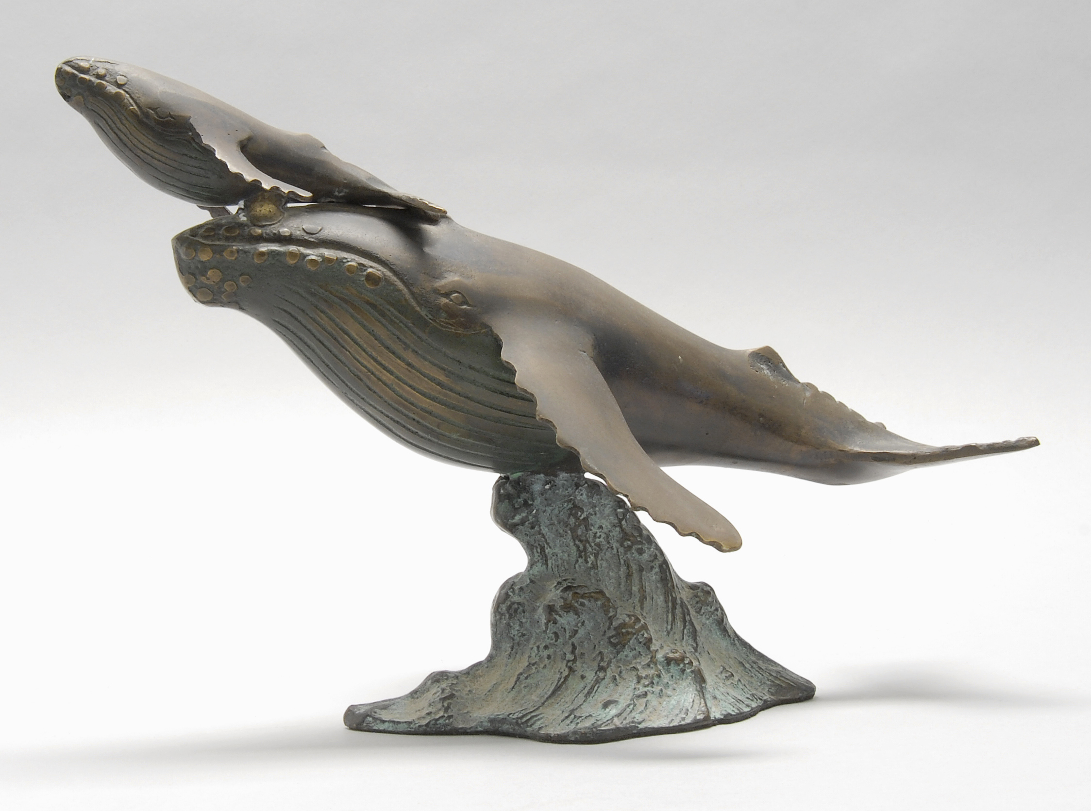 Appraisal: CAST METAL SCULPTURE OF A MOTHER WHALE AND CALF Height