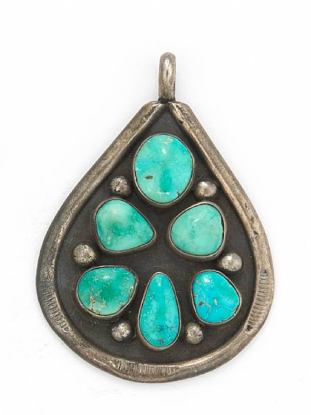 Appraisal: A turquoise silver mounted pendant engraved on back length of