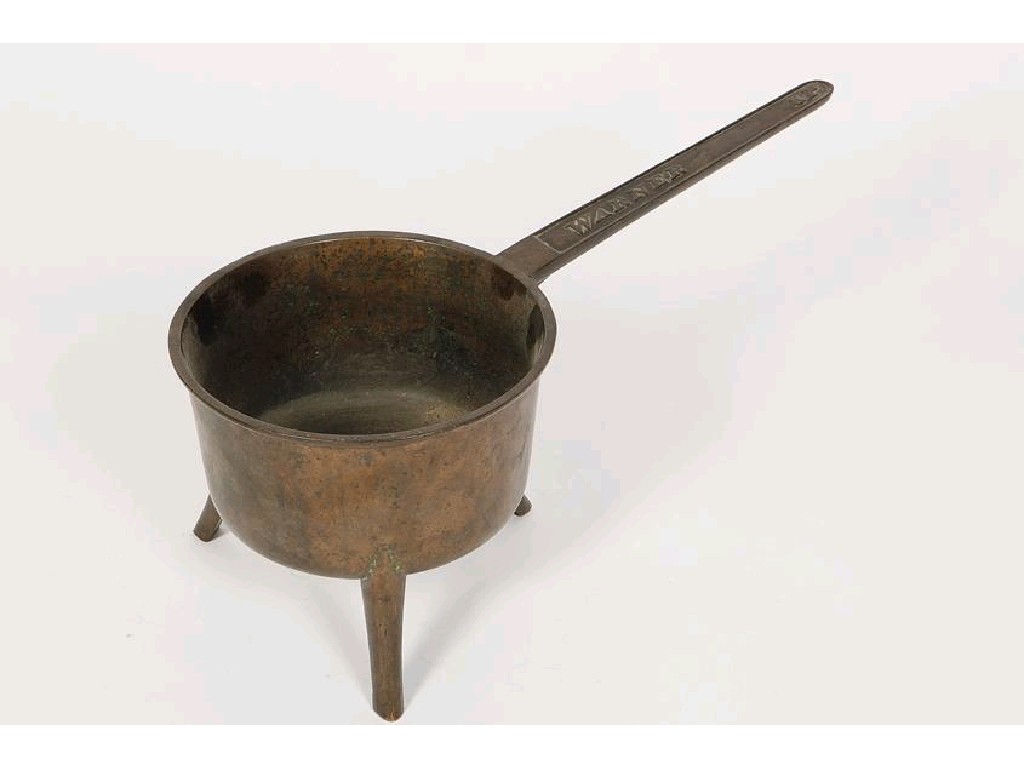 Appraisal: A LARGE BRONZE SKILLET of traditional form on three legs