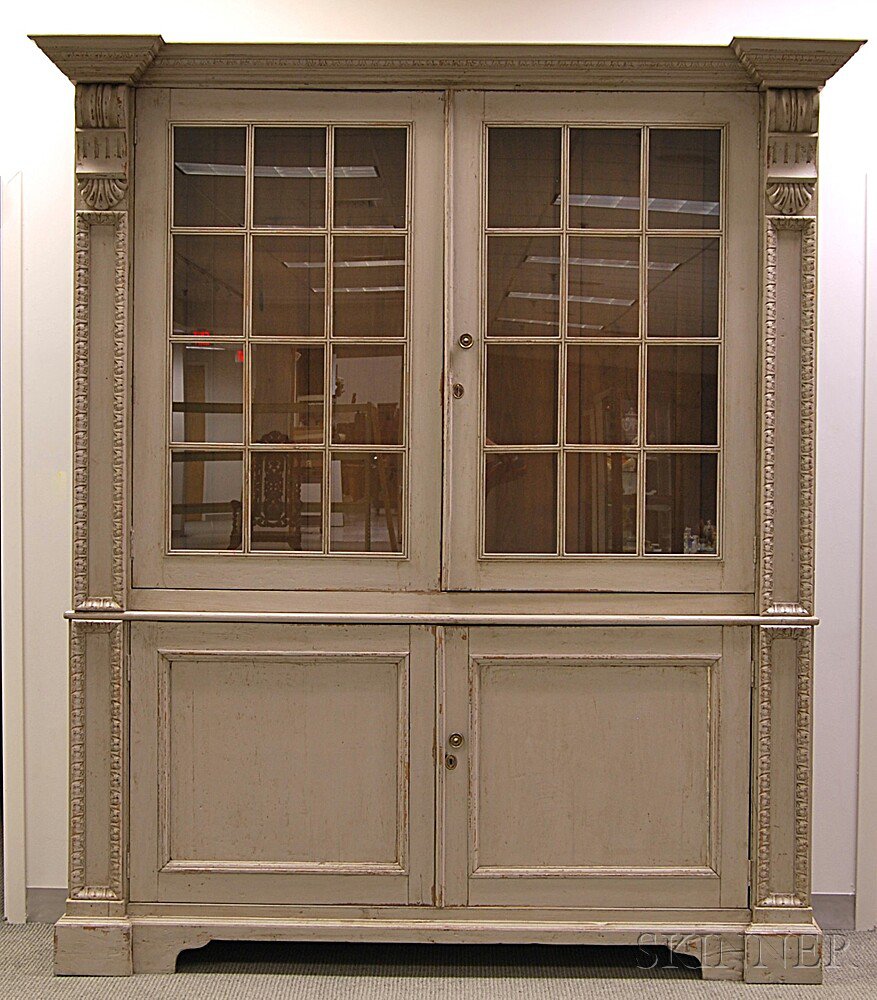 Appraisal: French Provincial-style Gray-painted and Carved Cupboard the egg-and-dart-molded cornice over