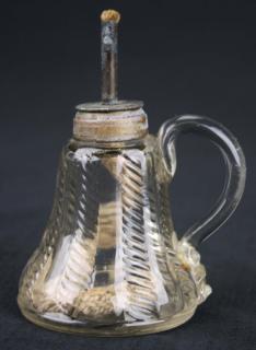 Appraisal: th c pattern molded sparking lamp with burner clear cable