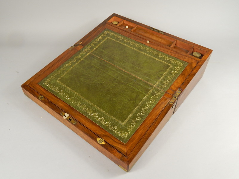 Appraisal: A Victorian walnut and brass bound writing box the hinged