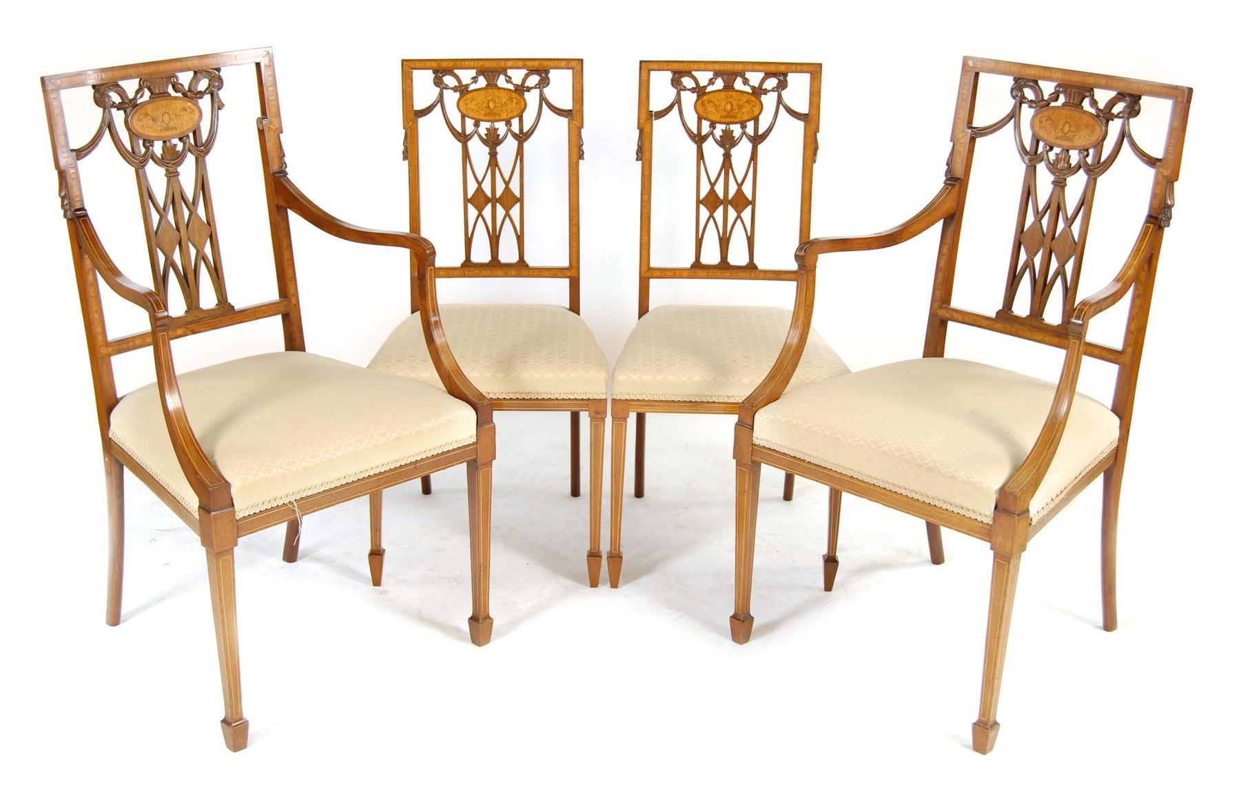 Appraisal: A pair of Edwardian mahogany open armchairs in Sheraton style