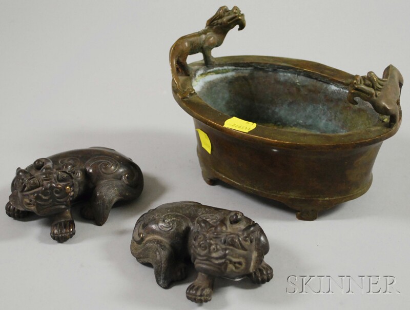 Appraisal: Chinese Bronze Footed Censer and a Pair of Foo Dogs