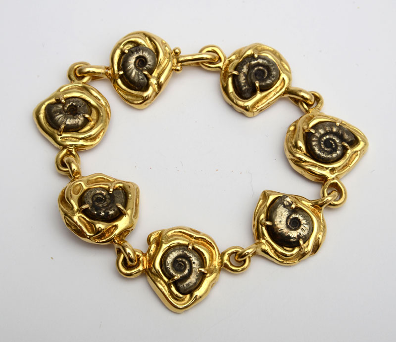 Appraisal: ELIZABETH GAGE K YELLOW GOLD AND FOSSILIZED SHELL BRACELET Signed