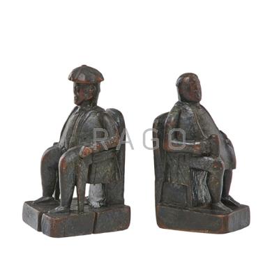 Appraisal: PAIR OF FOLK ART BOOKENDS Carved seated figures th c