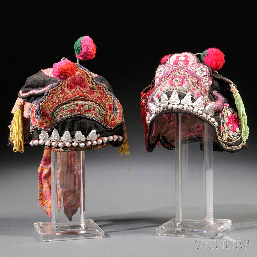 Appraisal: Two Child's Hats China th century with colorful embroidery against