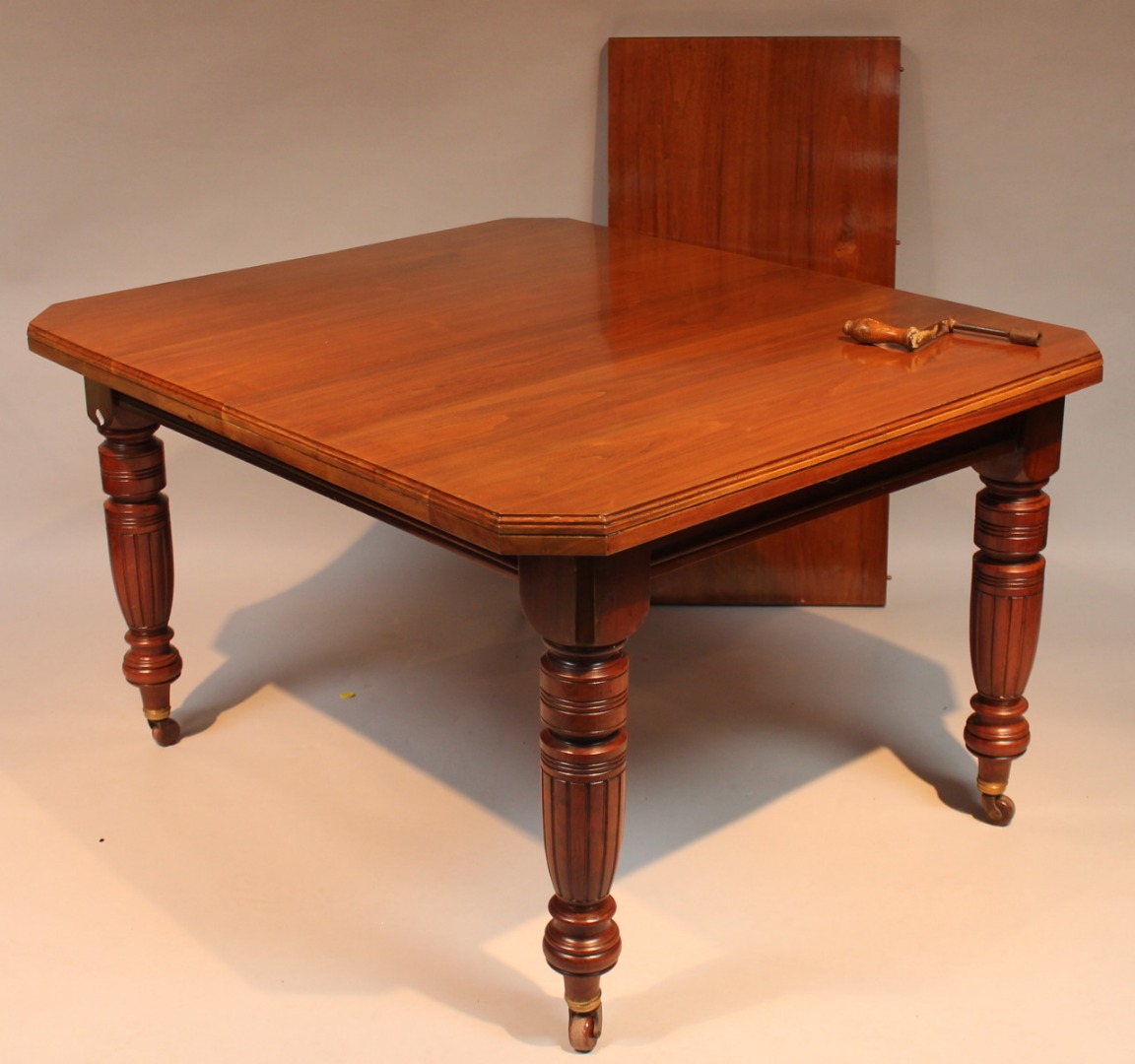 Appraisal: A late Victorian walnut dining table the plain top with