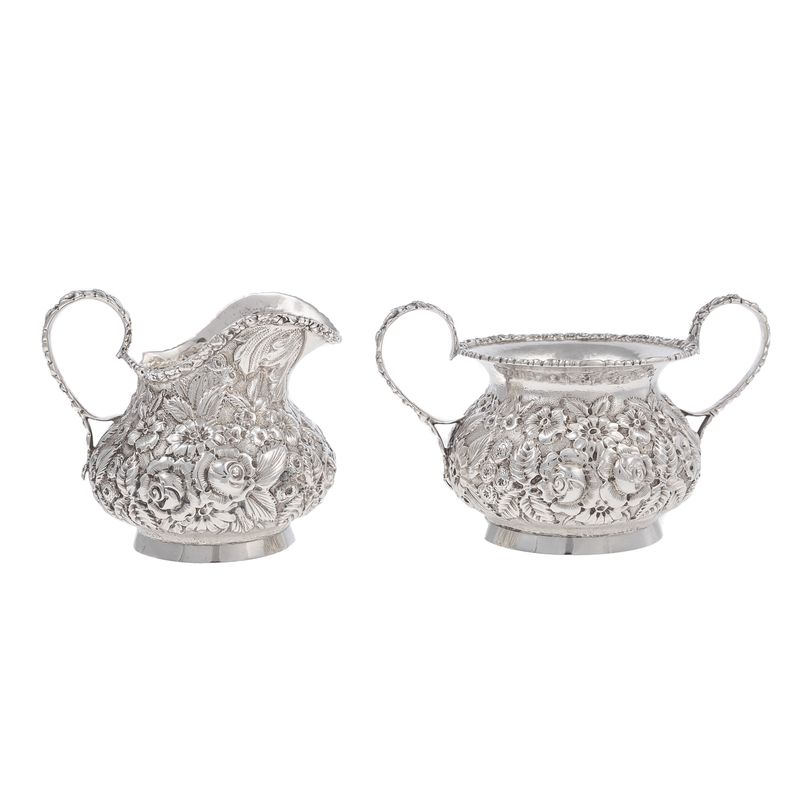 Appraisal: STIEFF STERLING REPOUSSE CREAMER SUGAR Crisply modeled in an allover