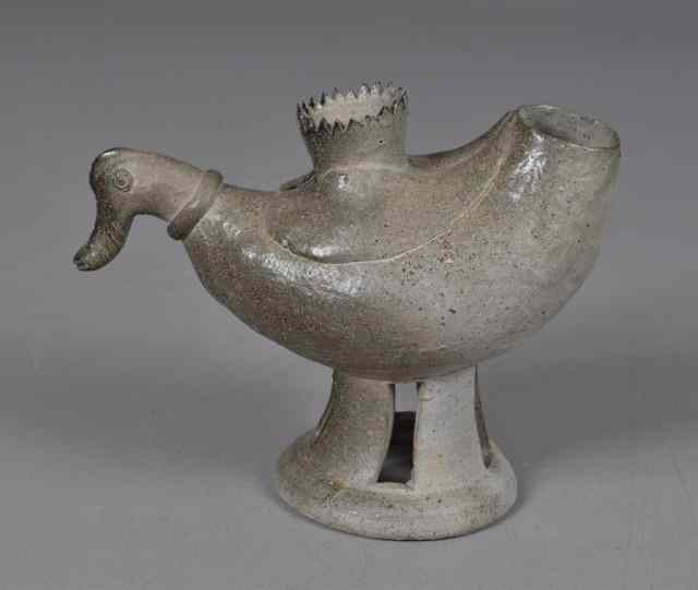 Appraisal: An Unusual Bird Form Pottery FigureProbably American to mimick a