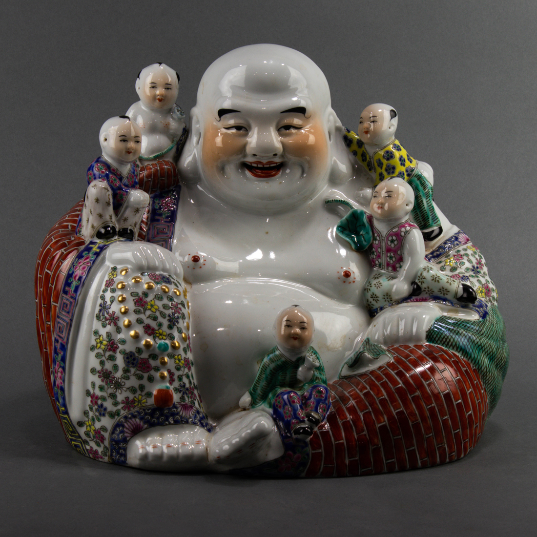 Appraisal: CHINESE FAMILLE ROSE FIGURE OF BUDAI Chinese famille rose figure