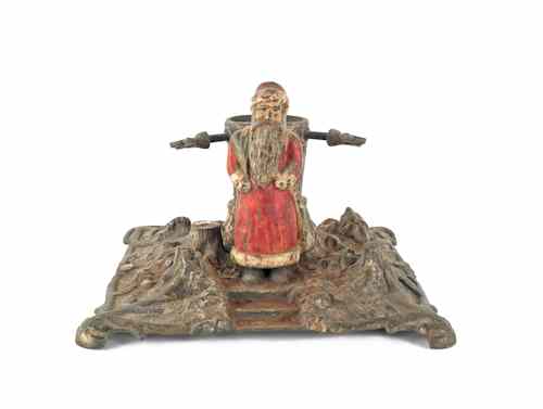 Appraisal: Cast iron Christmas tree stand late th c with figural