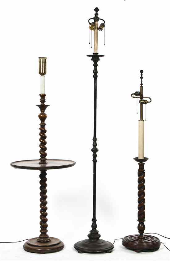 Appraisal: A Group of Three Floor Lamps comprising two twist carved