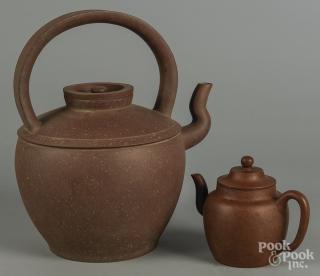 Appraisal: Two Chinese Yixing teapots '' h and '' h