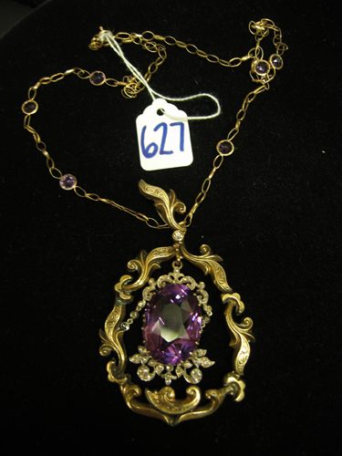 Appraisal: AMETHYST DIAMOND AND NINE KARAT YELLOW GOLD PENDANT NECKLACE The