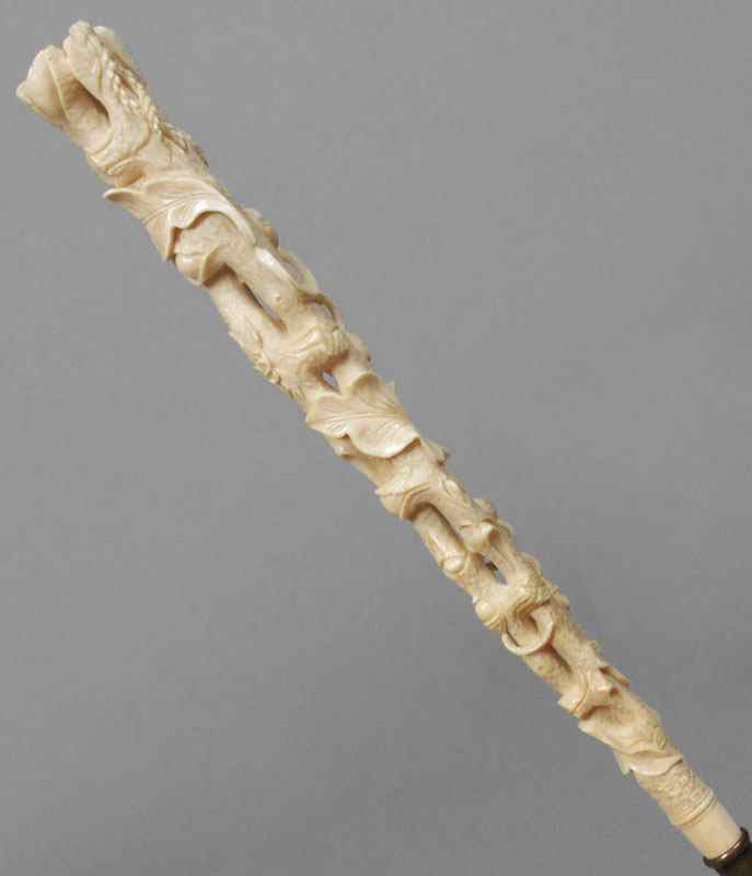 Appraisal: VICTORIAN CARVED IVORY HANDLE PARASOL Folding parasol of point de