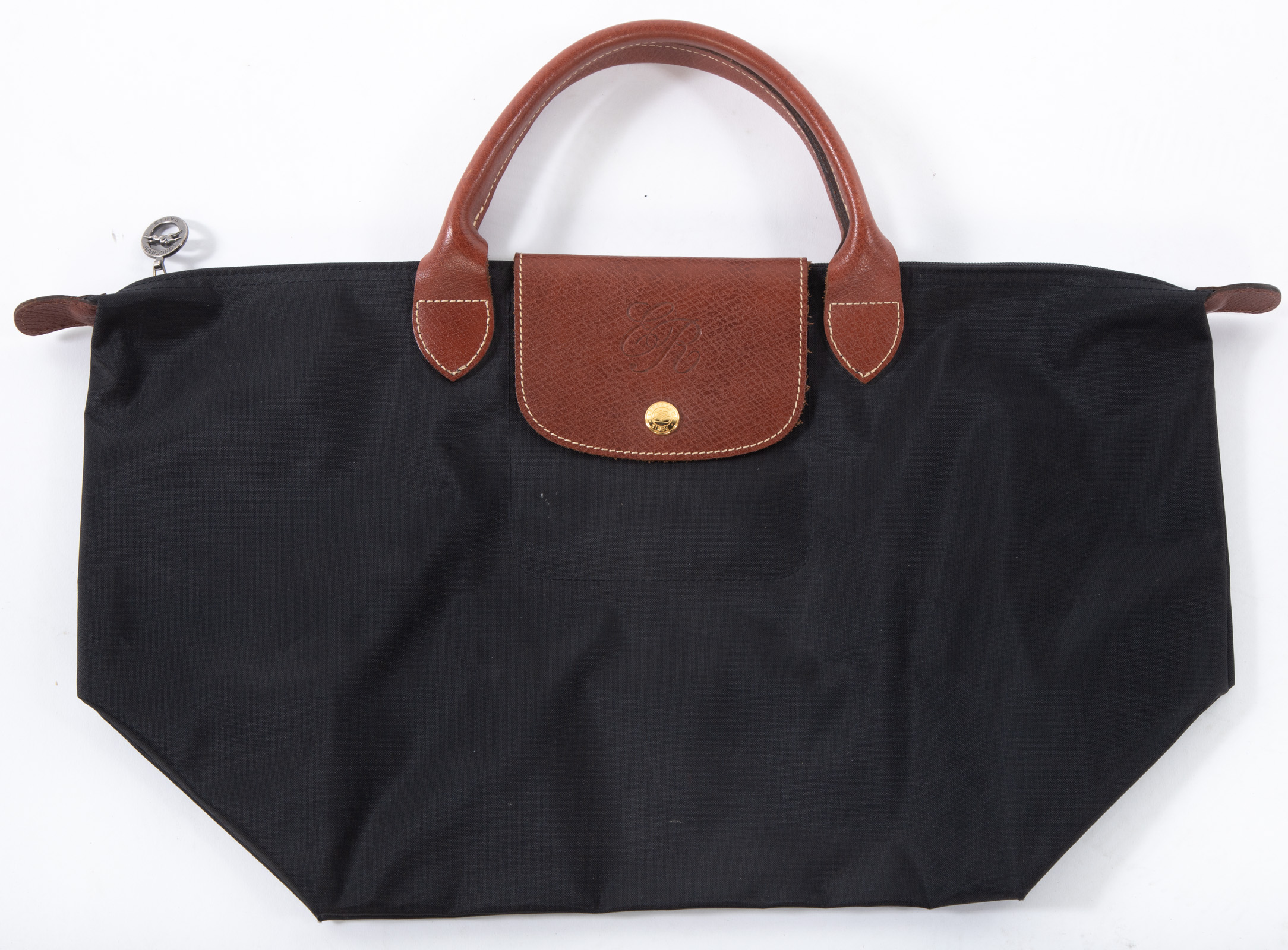 Appraisal: LONGCHAMP BLACK NYLON LE PLIAGE HANDBAG monogrammed in H in