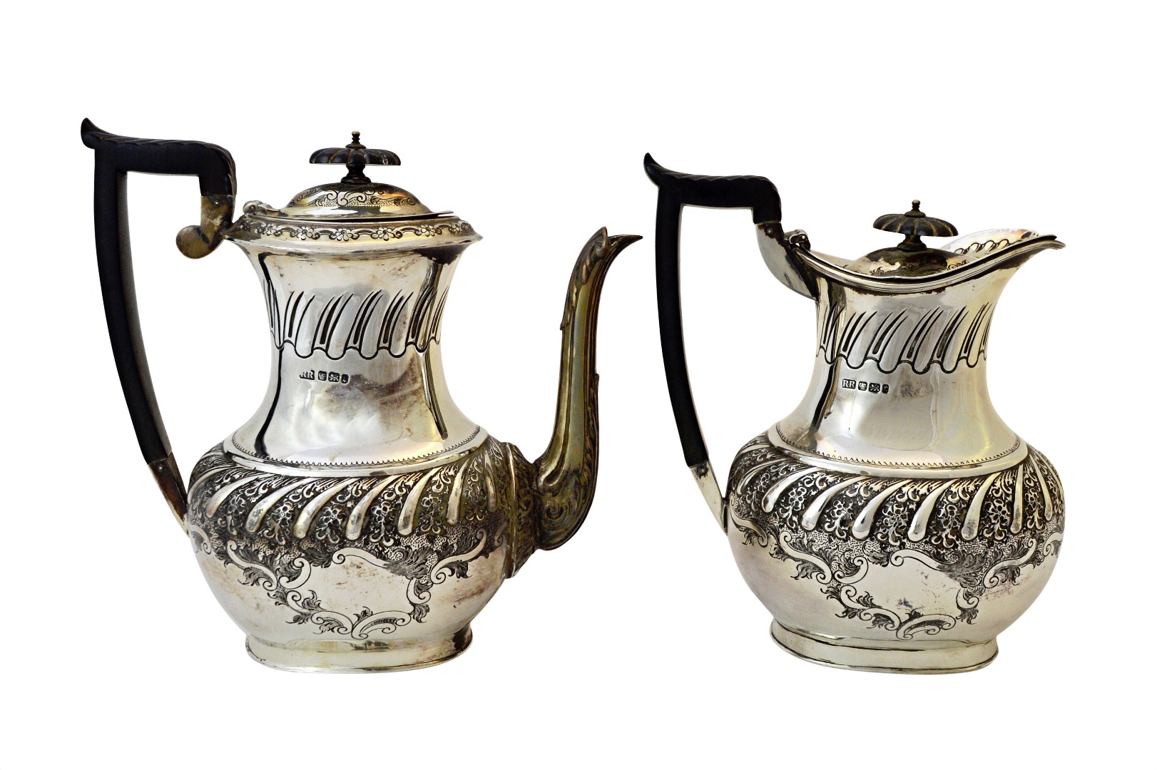 Appraisal: A late Victorian silver coffee pot with a matching hot