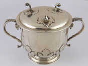 Appraisal: A silver two handled cup and cover in the late