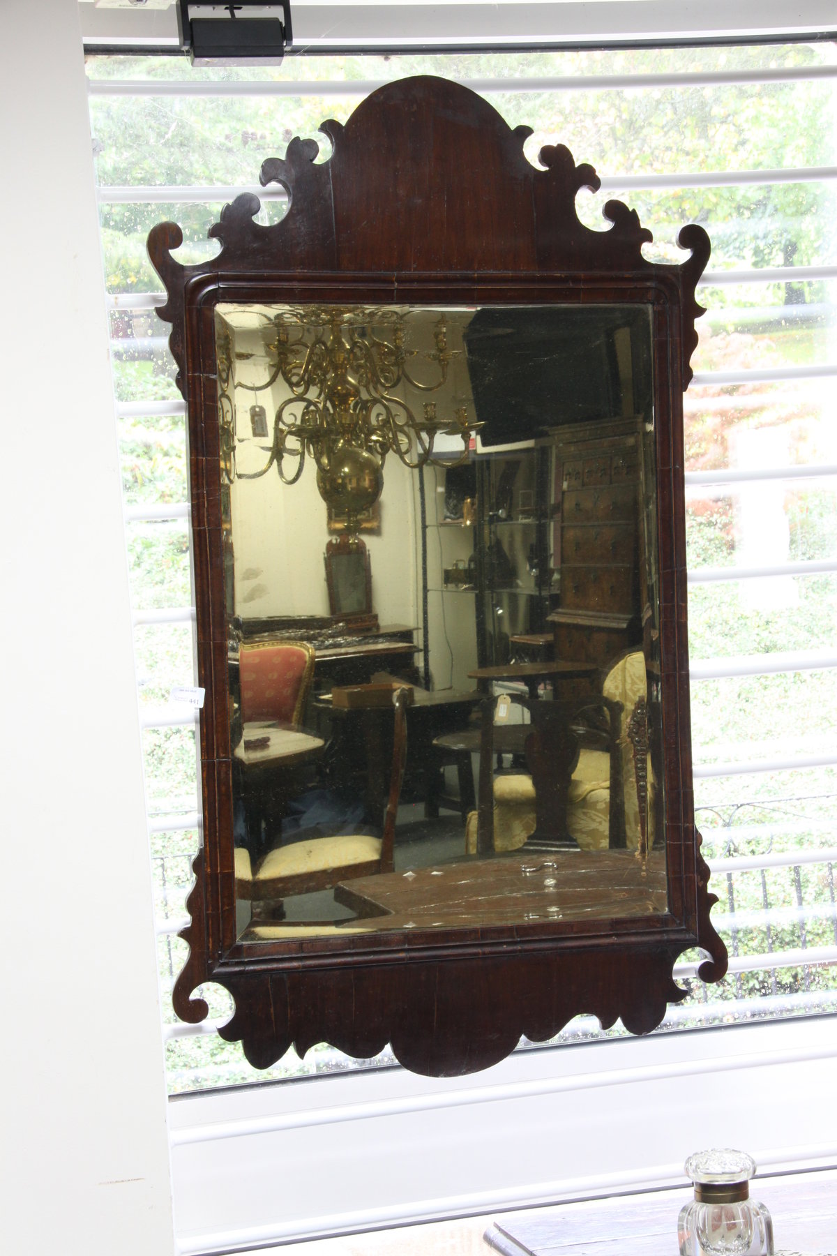 Appraisal: A George II red walnut fret framed mirror with rectangular