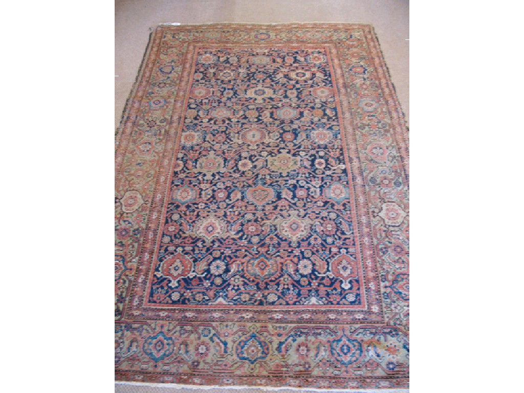 Appraisal: A PERSIAN RUG OF TABRIZ TYPE the blue ground central