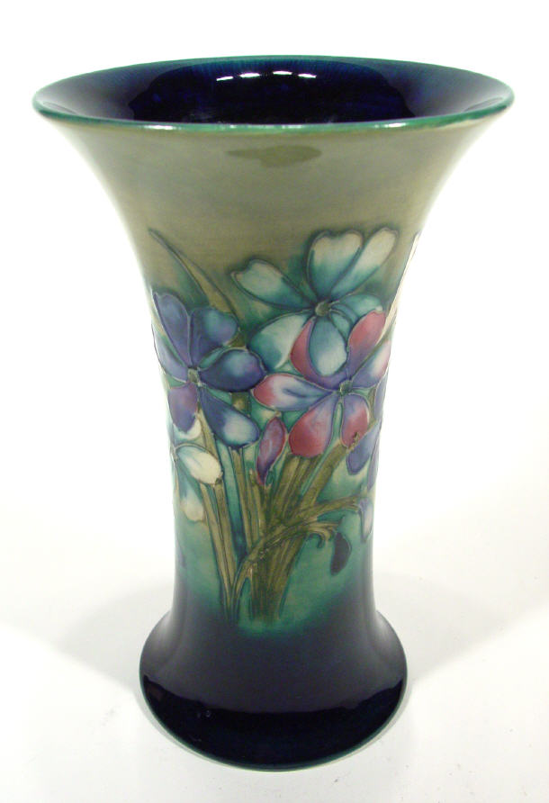 Appraisal: Moorcroft pottery trumpet vase hand painted and tubelined with spring