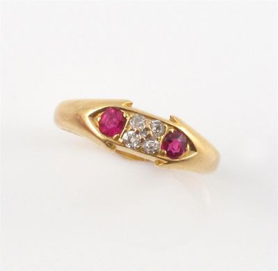 Appraisal: A gold ring set with two rubies and four diamonds