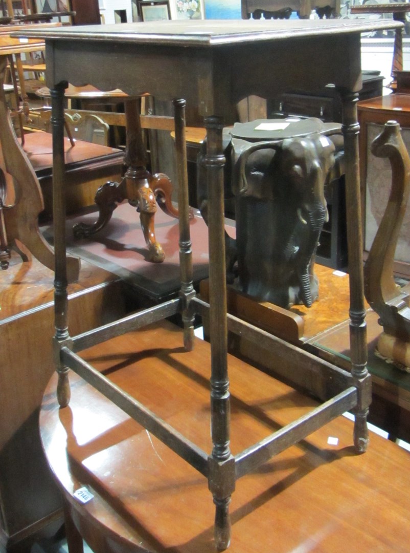 Appraisal: An early th century oak two tier occasional table