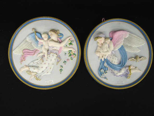 Appraisal: Pair of French Victorian Bisque Plaques angels cherub children handpainted