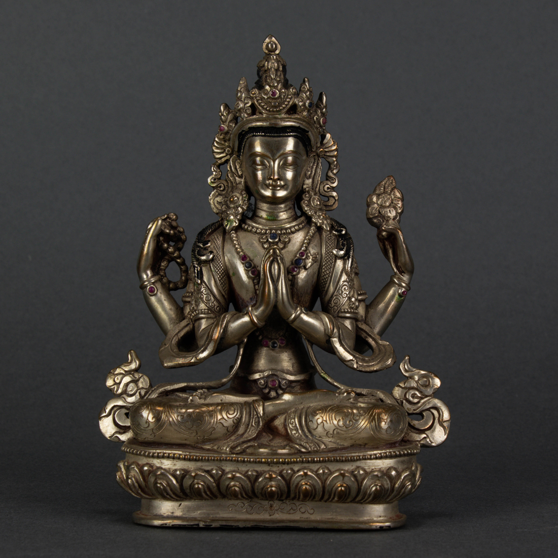 Appraisal: HIMALAYAN SILVERED BRONZE FIGURE OF CHENREZIG Himalayan silvered bronze figure