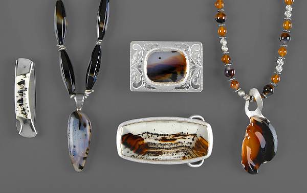 Appraisal: Without Reserve A drop-shaped pendant set with a cabochon Montana