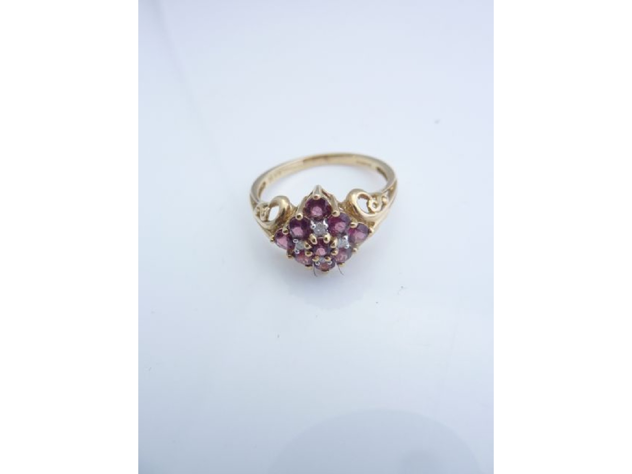 Appraisal: A gem-set ring set with pink stones possibly tourmaline and