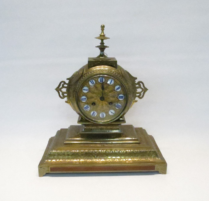 Appraisal: FRENCH SOLID BRASS JAPPY FRERES MANTLE CLOCK with porcelain roman