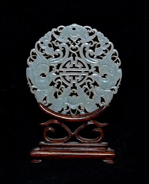 Appraisal: A Chinese pierced and carved mutton fat jade medallioncirca carved