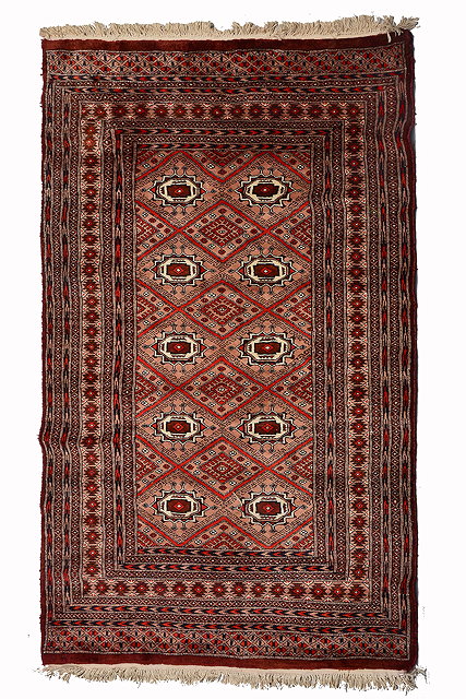 Appraisal: A PAKISTANI BOKHARA STYLE RUG decorated two rows of four