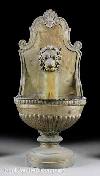 Appraisal: An Italian Classical-Style Bronze Wall Fountain the scrolled back centered