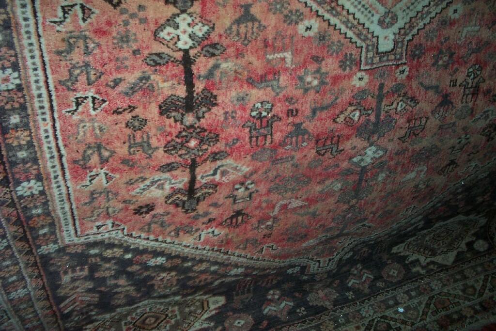 Appraisal: A pink ground wool carpet with Eastern style floral animal