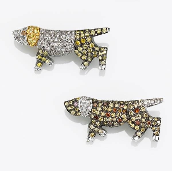 Appraisal: A pair of colored diamond and diamond dog brooches estimated