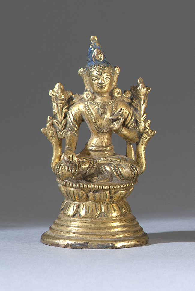 Appraisal: GILT-BRONZE FIGURE OF TARA th CenturySeated on a two-tier lotus