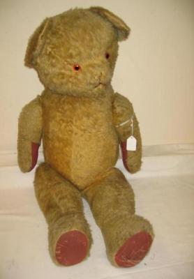 Appraisal: A large gold mohair articulated teddy bear with plain stitched