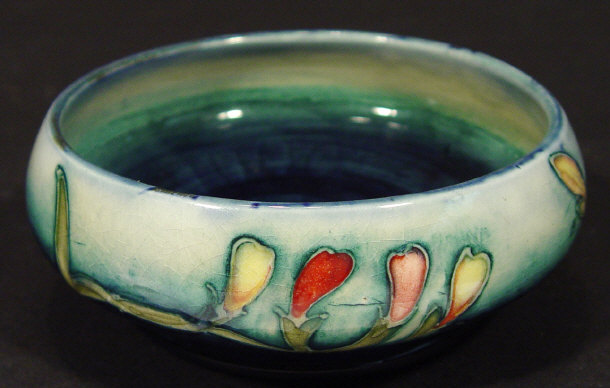 Appraisal: Moorcroft pottery bowl hand painted and tubelined with floral buds