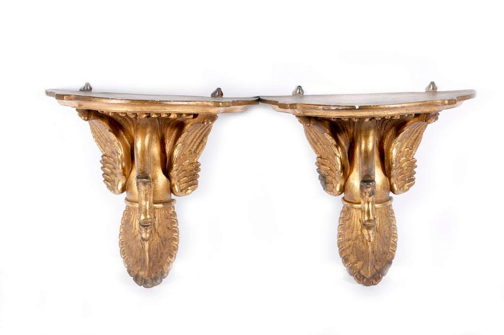 Appraisal: A pair of brackets and a sconce A pair of